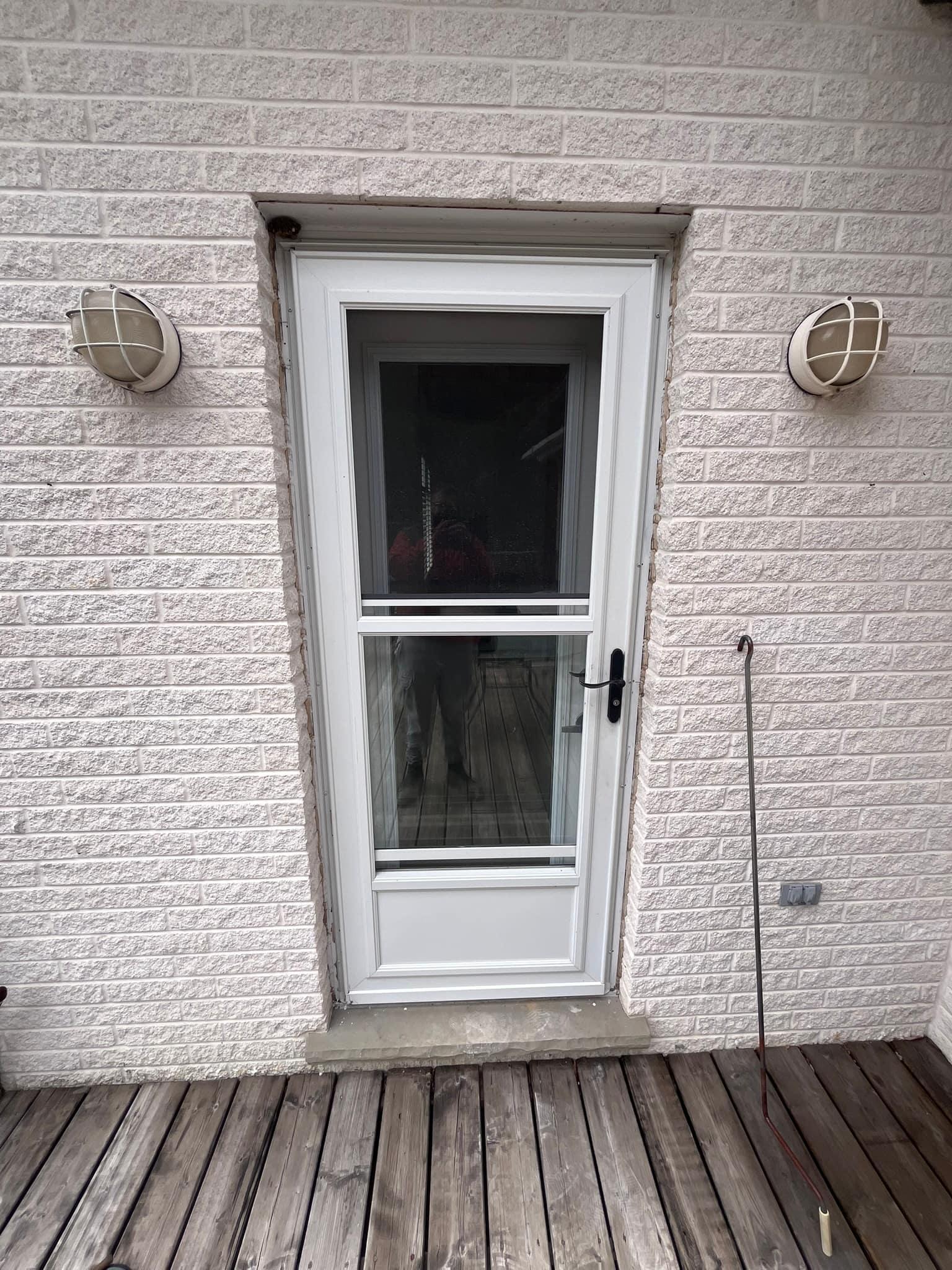 Original single back door and storm door from outside