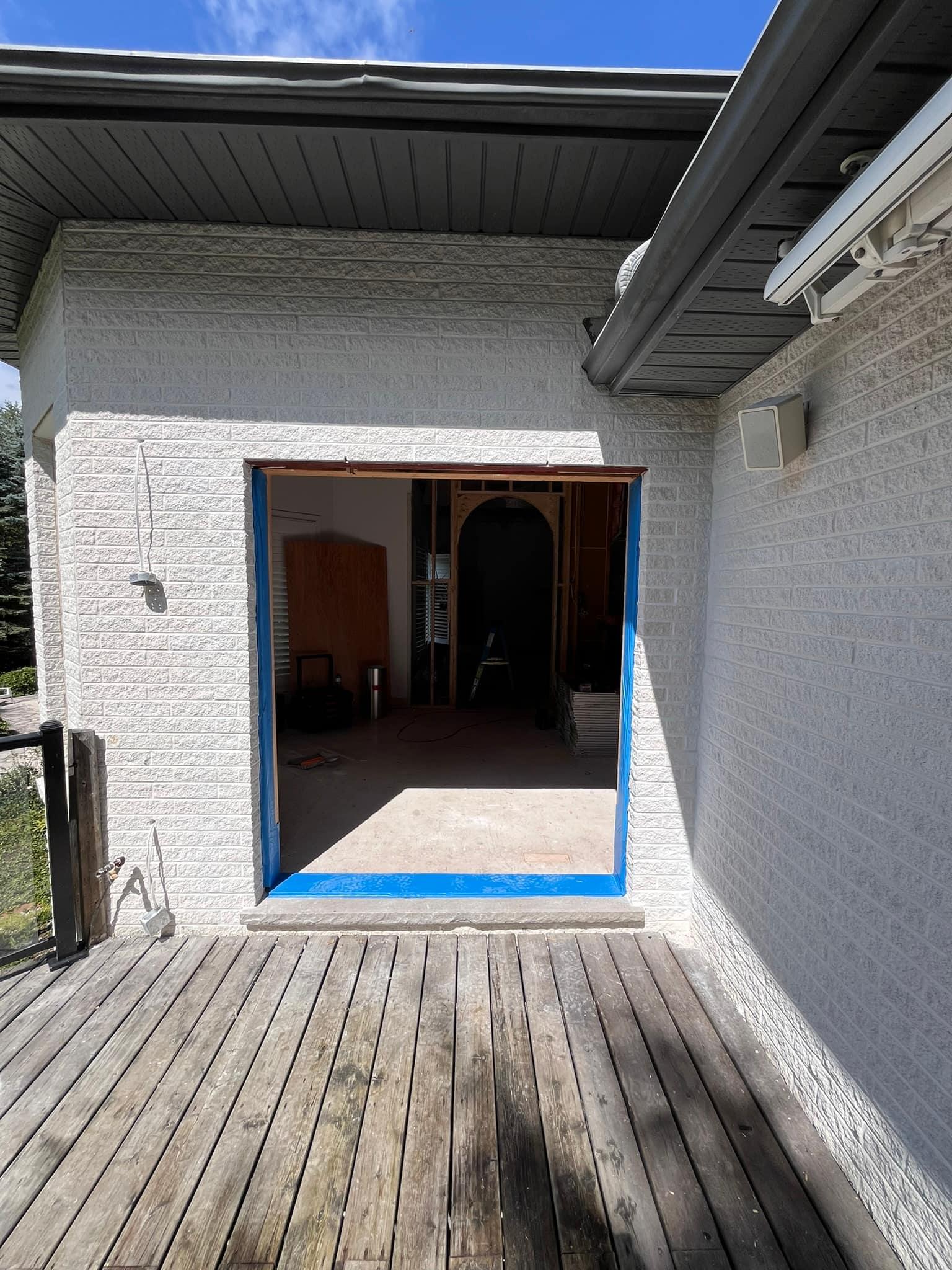 Widened opening from the deck, taped and ready for the door
