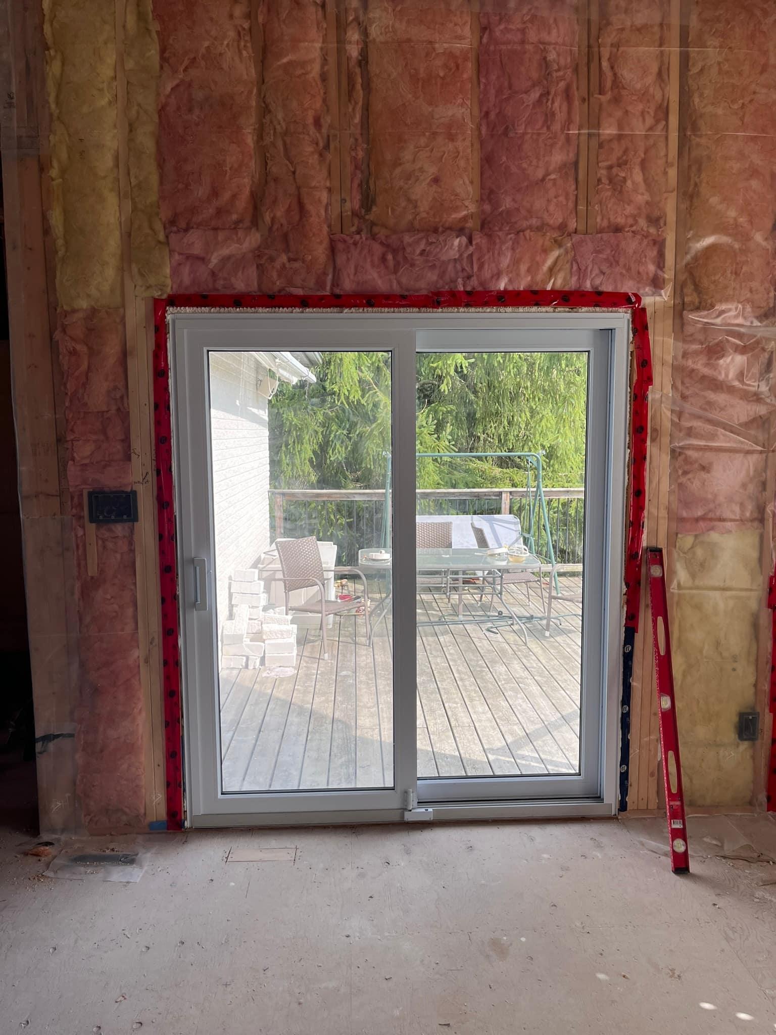 New sliding patio door from inside, set in the framed opening